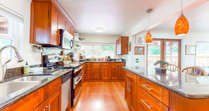 Dog-friendly riverfront home with patio, golf nearby, enclosed yard, & W/D