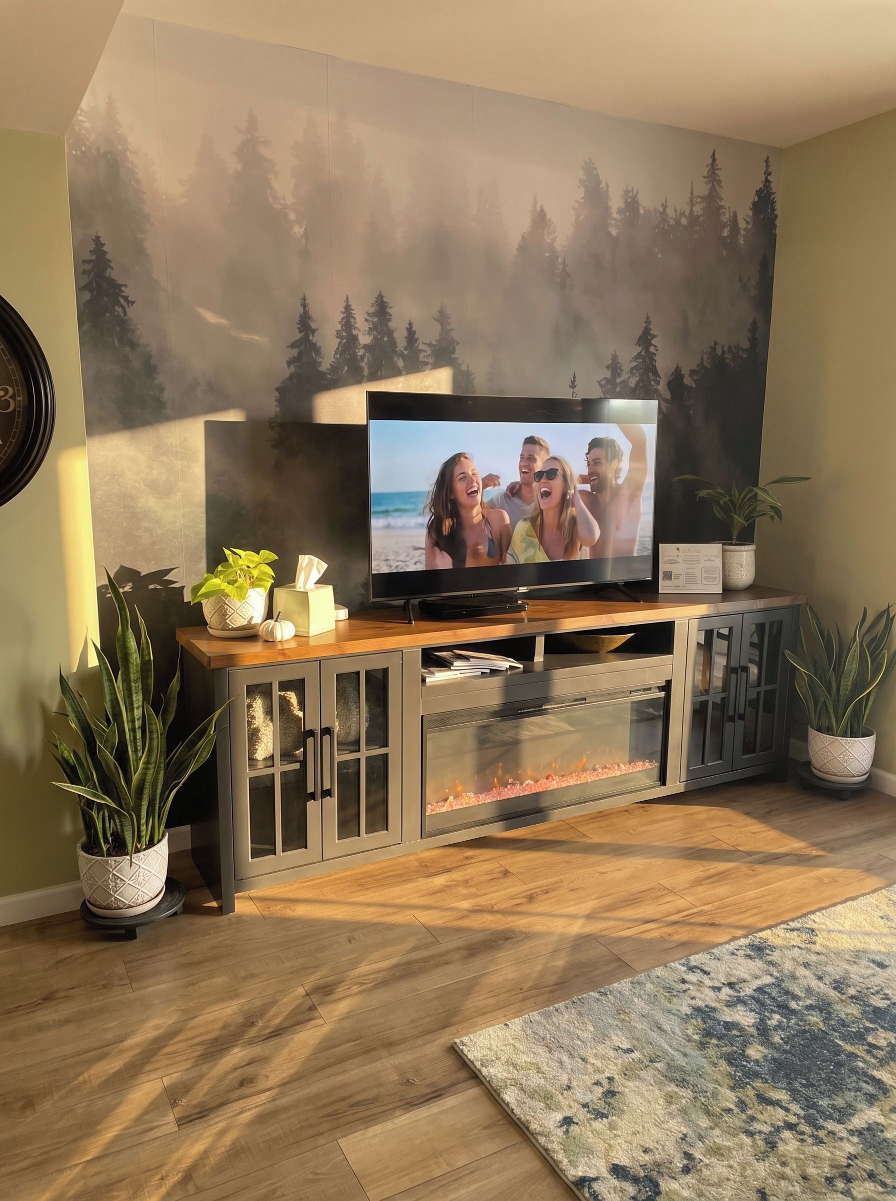 A living room with a flat-screen TV on a wooden stand, a fireplace, and potted plants.
