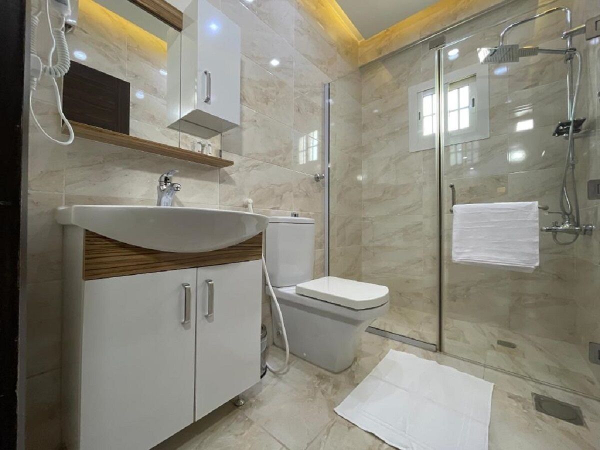 Designer toiletries, hair dryer, slippers, bidet