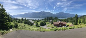 A residential area with houses, a road, and mountains in the background. - Epic Columbia River views * New Modern Home in the heart of the gorge. (Carson)