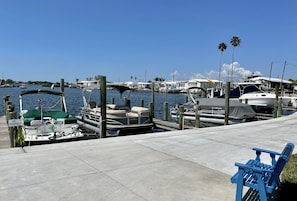 Stroll along the marina's concrete walkway and enjoy the views of the boats docked at the piers.
