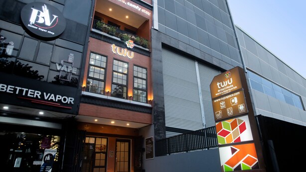 A building with a sign for 'Better Vapor' and 'tuju' on the ground floor. - Tuju Arteri Pods by Zuzu (Jakarta)
