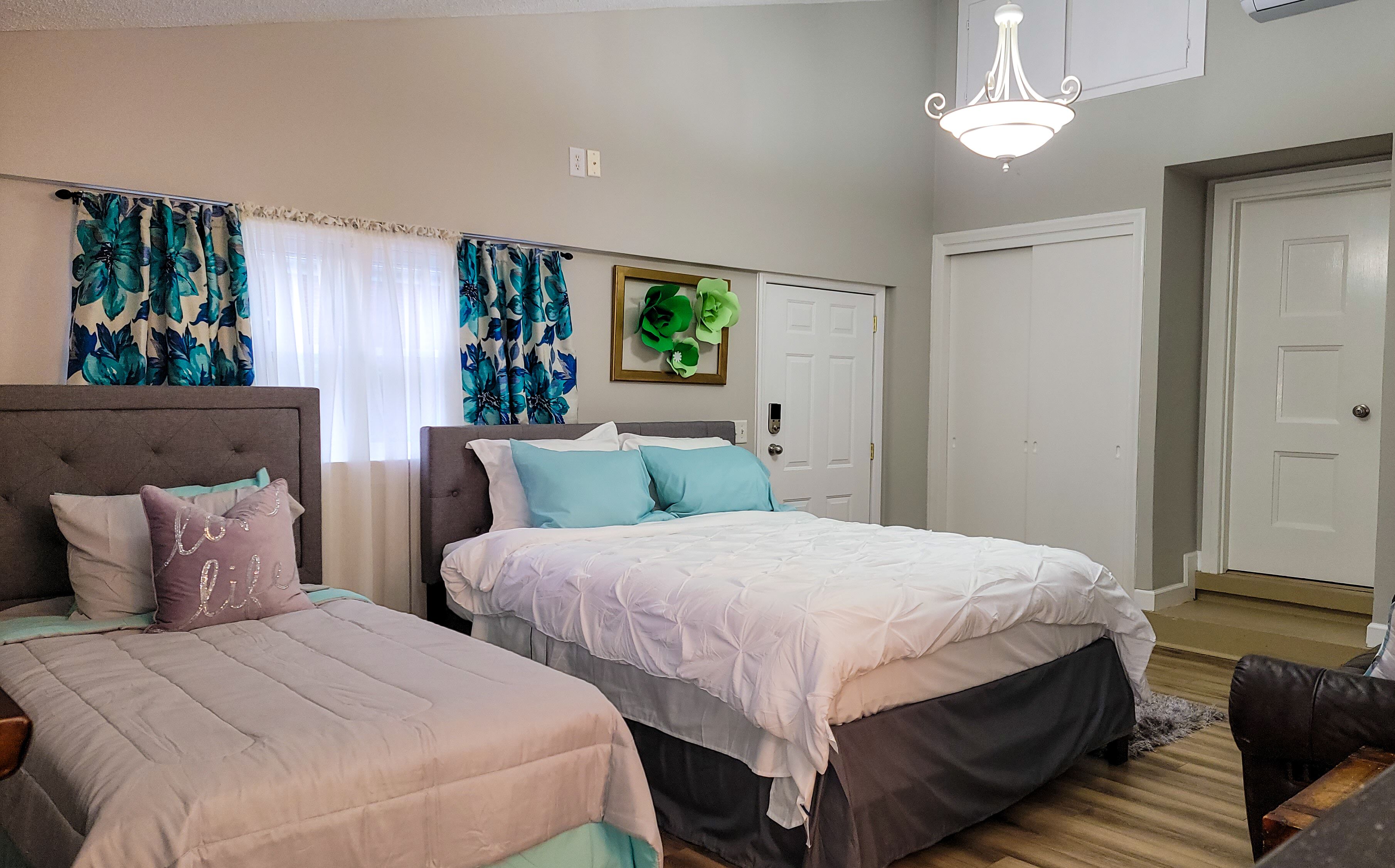 Renovated Suite with 1 queen bed and a Twin. Kitchen & bath for your privacy.