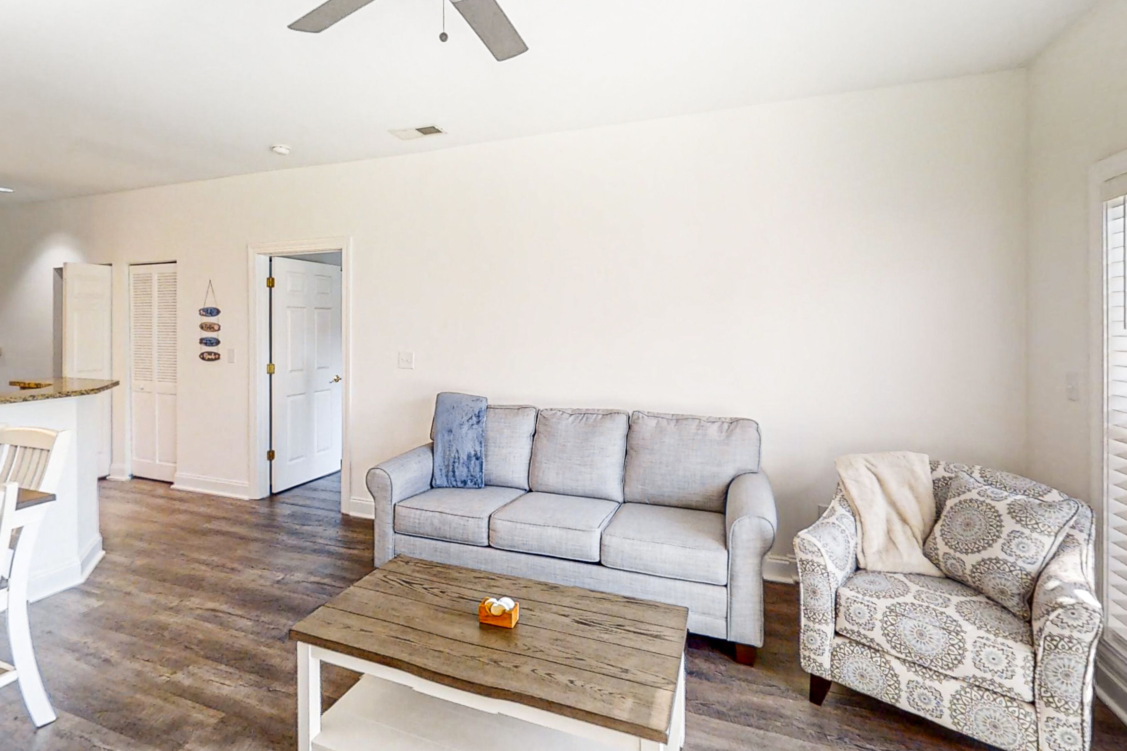 Fairway-view condo with on-site golf, pool, private balcony, AC, & W/D