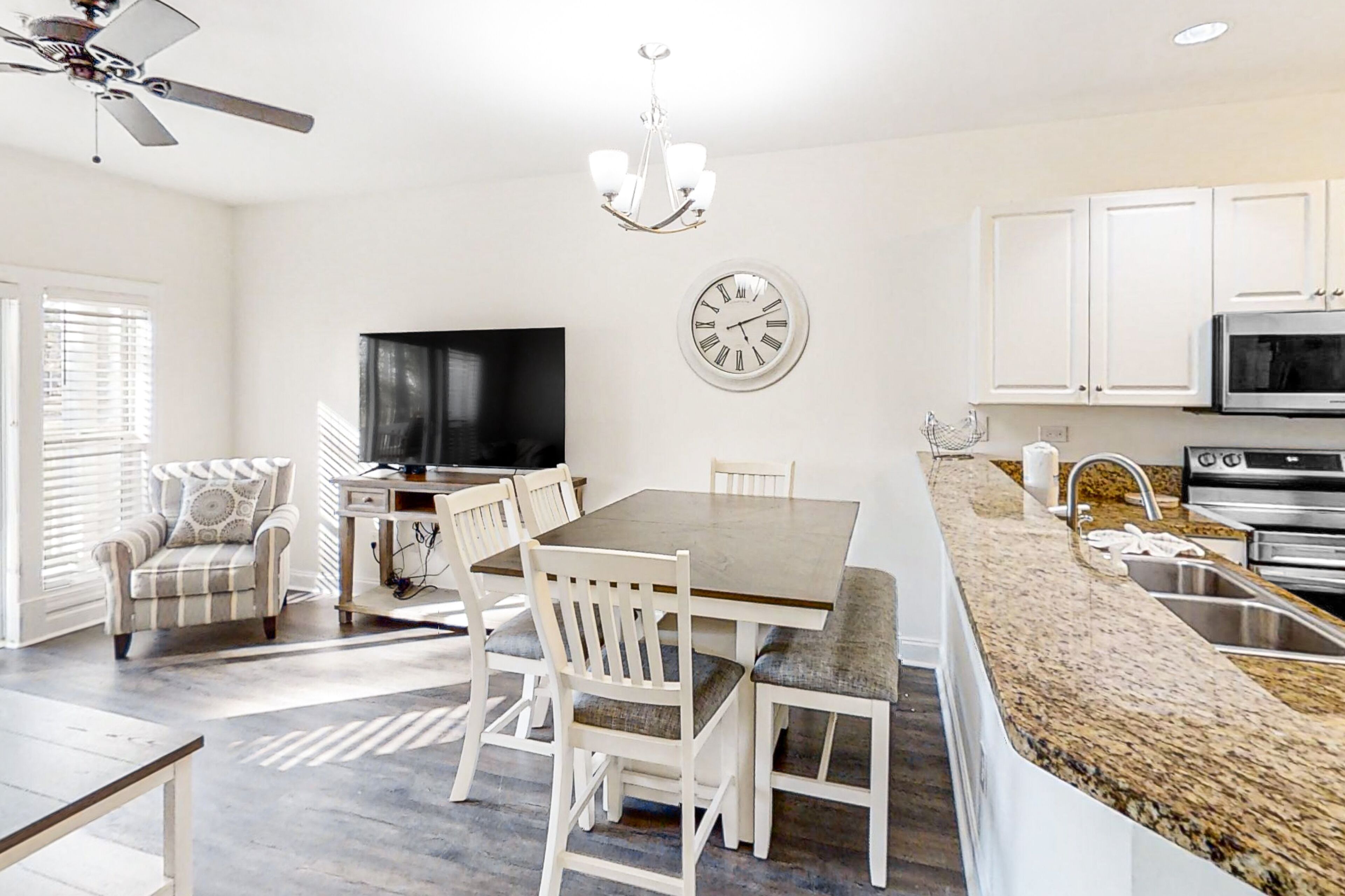 Fairway-view condo with on-site golf, pool, private balcony, AC, & W/D