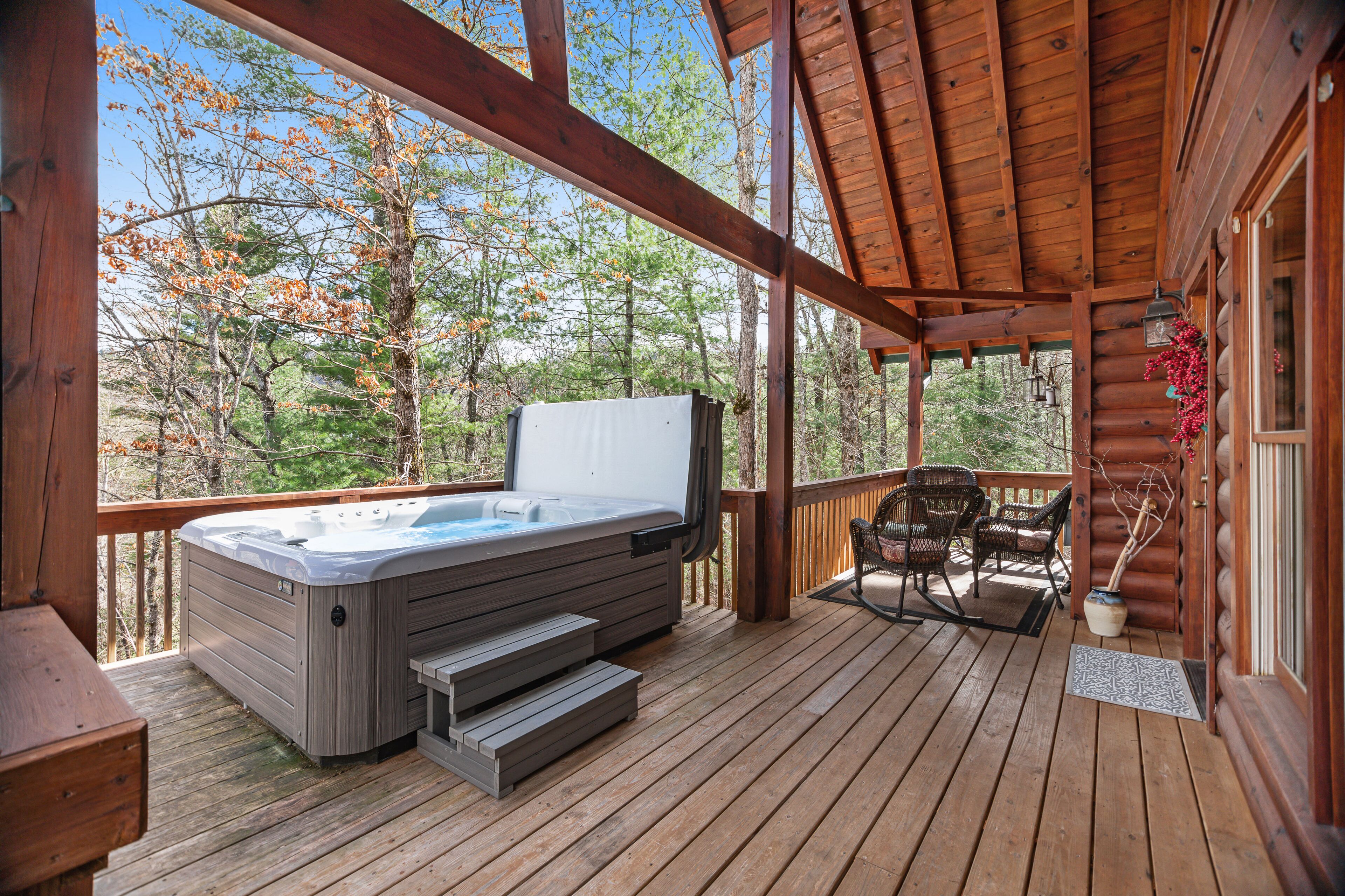 Mountain-view cabin with private hot tub, covered deck, & washer/dryer