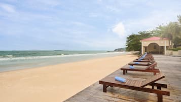On the beach, sun loungers, beach umbrellas, beach towels