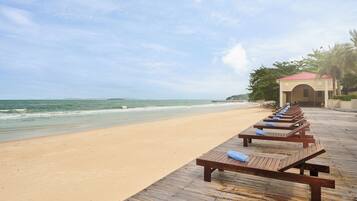 On the beach, sun loungers, beach umbrellas, beach towels