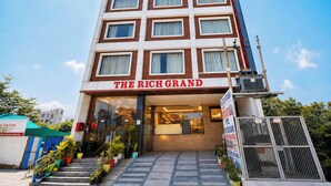 A multi-story hotel building with a prominent sign reading 'THE RICH GRAND.' - HOTEL The Rich Grand (Agra)