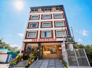 A multi-story hotel building with a prominent sign reading 'THE RICH GRAND.' - HOTEL The Rich Grand (Agra)