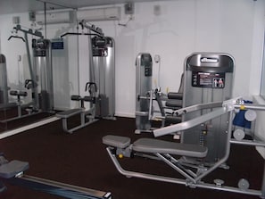 Stay fit on the go with a fully equipped gym featuring weight machines and free weights.
