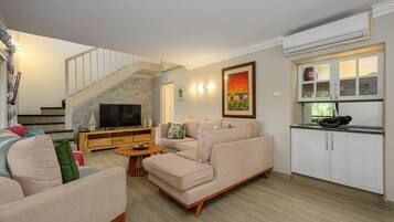 Classic Villa | Living area | 45-inch flat-screen TV with satellite channels
