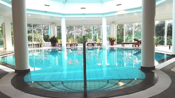 Indoor pool, pool umbrellas, pool loungers