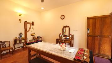 Relax in this inviting room with a marble-topped table, comfortable bench, and stylish cabinet.