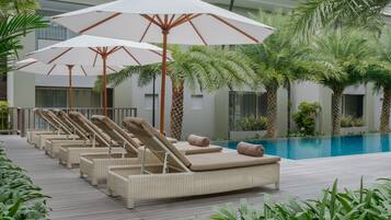 2 outdoor pools, open 7:00 AM to 8:00 PM, pool umbrellas, pool loungers