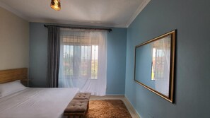 Departamento | 1 habitación, tabla de planchar con plancha, wifi gratis y ropa de cama