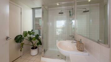 Basic Apartment, 1 Queen Bed | Bathroom | Shower, free toiletries, towels, soap