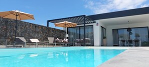Outdoor pool, a heated pool - CASA NIDO - Modern, very spacious villa with heated pool (Lajares)