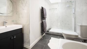 Shower, hair dryer, towels, soap
