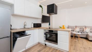 Apartment, 1 Bedroom, Balcony | Private kitchen | Microwave, oven, dishwasher, cookware/dishes/utensils
