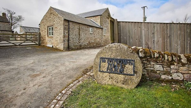 A stone building with a sign reading "Winnow Hill Farm." - Host & Stay | Mill (Consett)