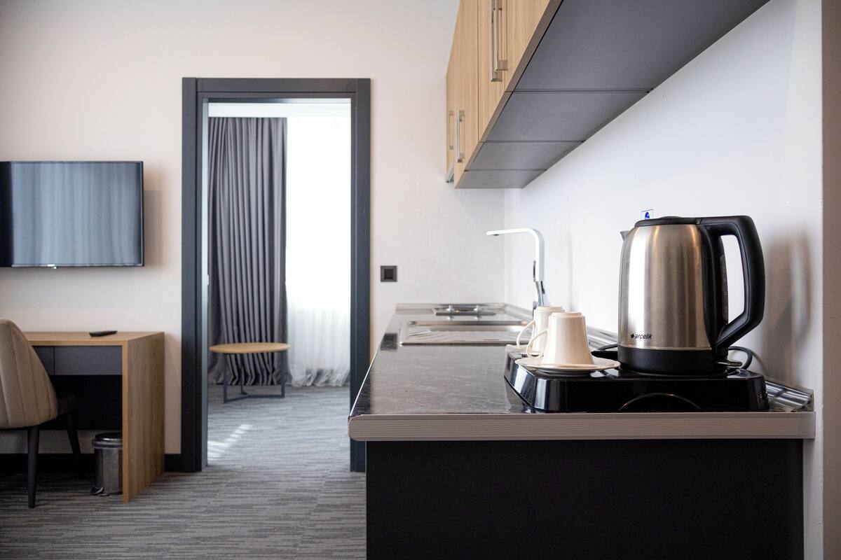 standard suite | living area | 72-inch tv with cable channels