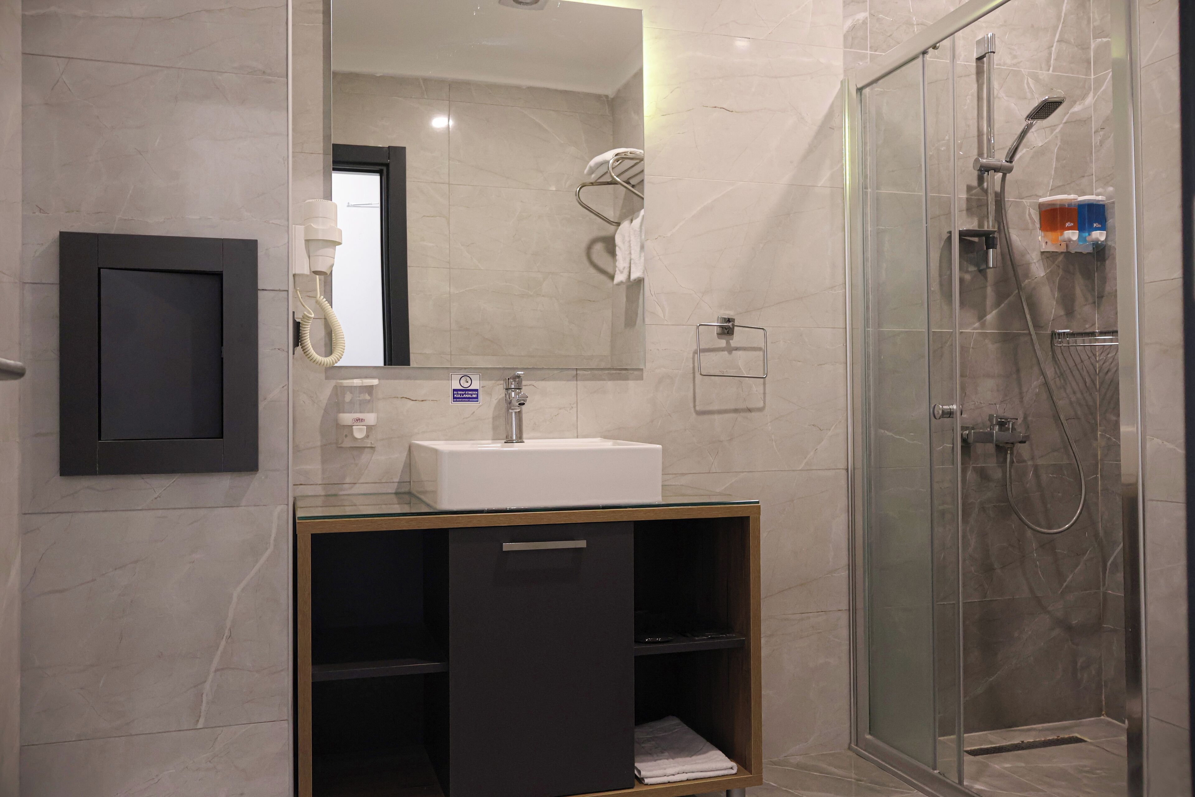 family room | bathroom | shower, rainfall showerhead, free toiletries, hair dryer