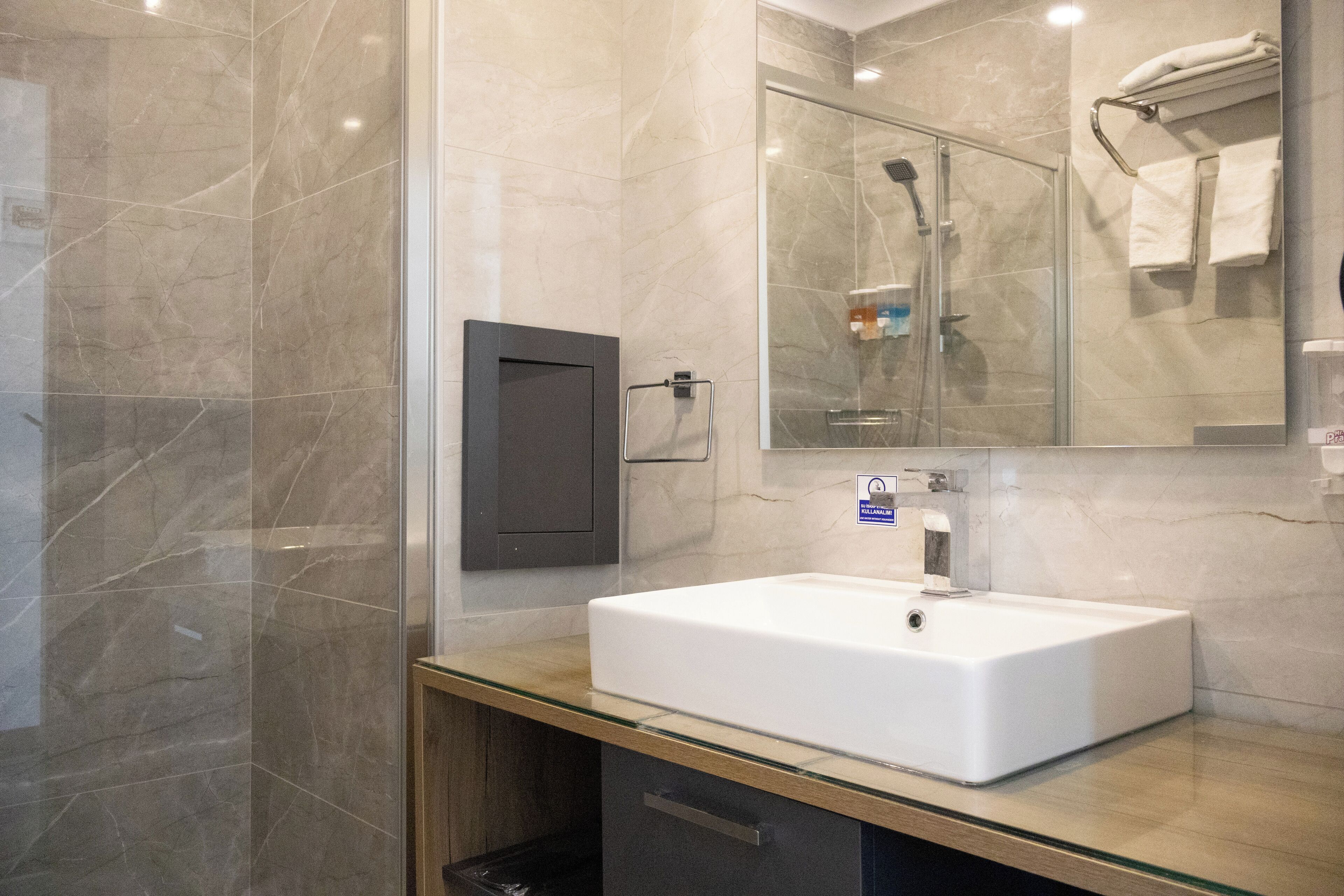 standard suite | bathroom | shower, rainfall showerhead, free toiletries, hair dryer
