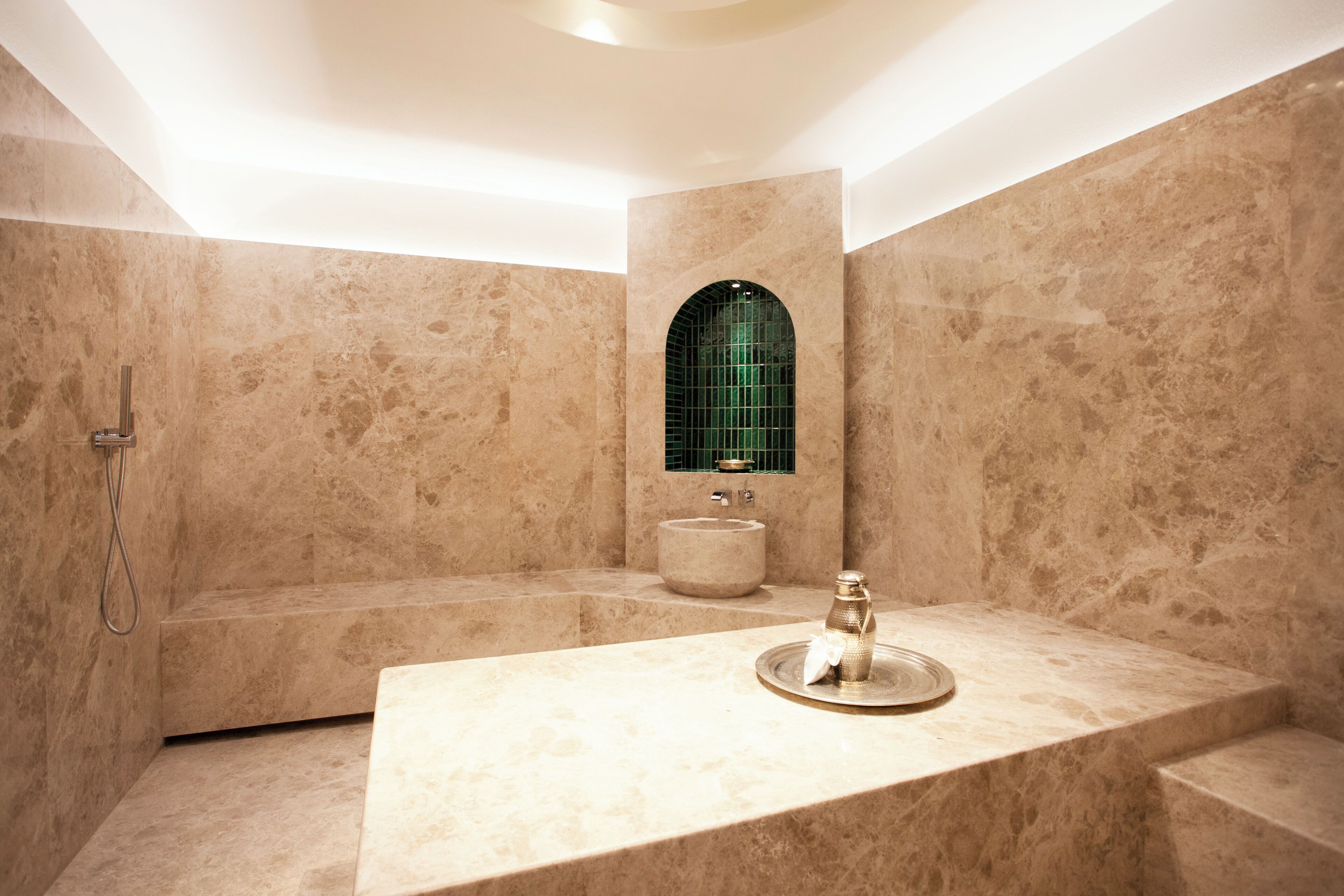 A modern bathroom with a freestanding bathtub, a sink, and a shower.