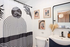 Bathtub, hair dryer, towels