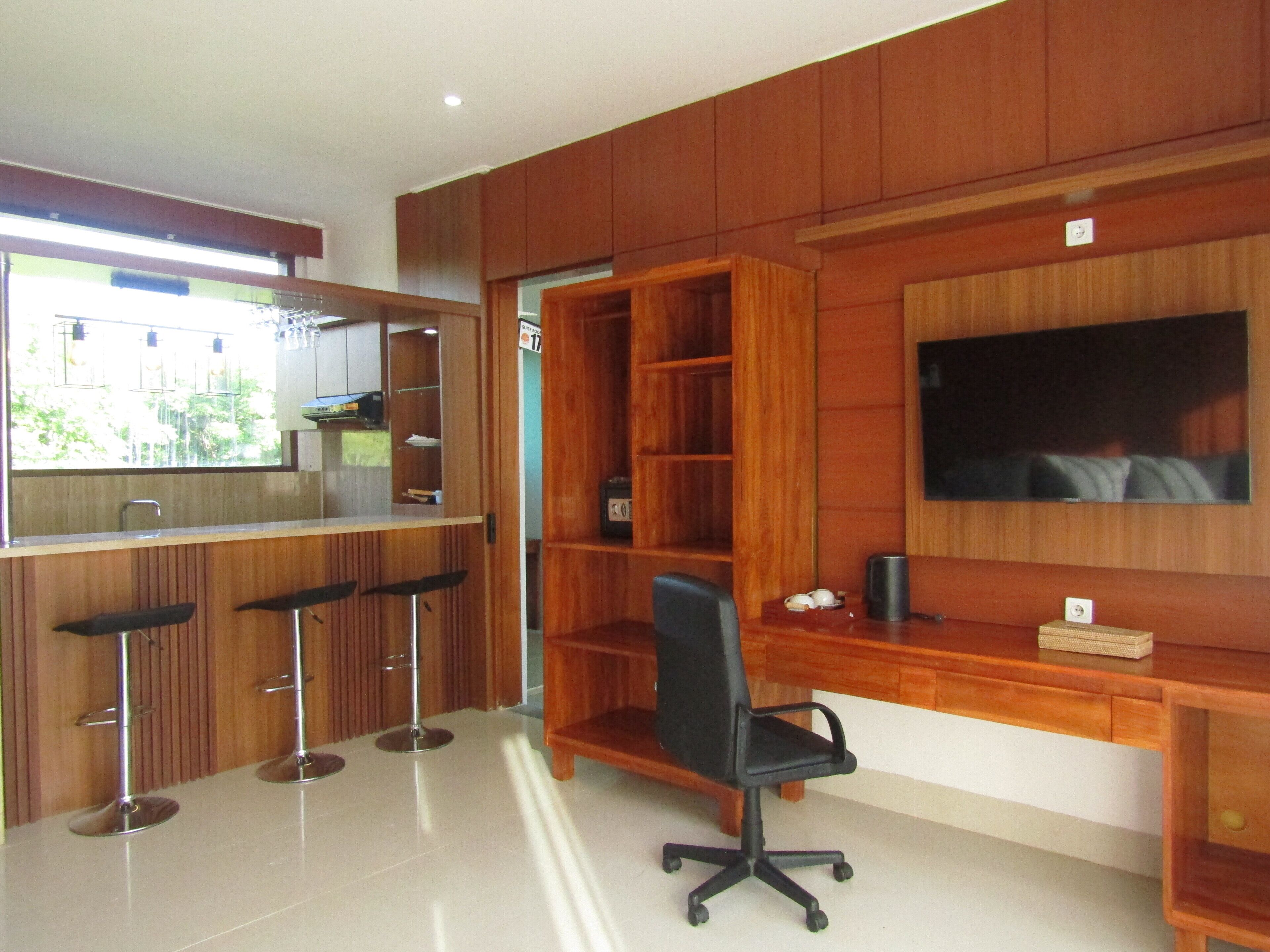 Superior Suite, 1 King Bed, Balcony, Pool View | Living area | 50-inch LED TV with digital channels, printers