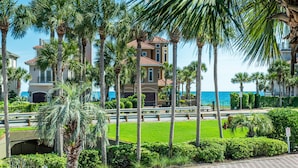 A beachfront property with a large house, palm trees, and a clear view of the ocean. - ☀️Waterfront Villa-Gulf Views-Pool-Walk to Restaurants-Destiny Beach Villa 15B☀️ (Destin)
