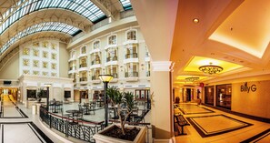 A spacious atrium with multiple floors, a central open area with seating, and a prominent restaurant named 'BillyG'. - The Ridge Hotel (Emalahleni)