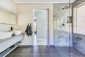Shower, hair dryer, towels, shampoo