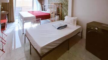 Family Triple Room | Premium bedding, minibar, desk, laptop workspace