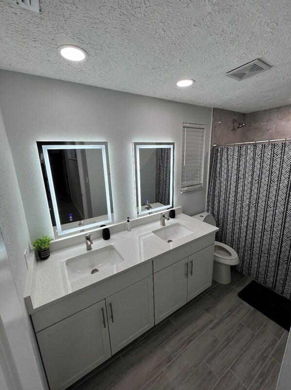 Shower, towels, soap, shampoo - Completely remodeled modern (Port Richey)