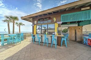 Outdoor dining - Completely renovated, huge balcony ocean front condo/beach chairs + umbrella! (Panama City Beach)