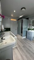 Family Triple Room | Bathroom | Hair dryer, towels, soap, toilet paper