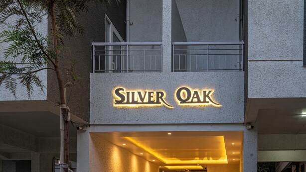 The exterior of a building with a sign that reads "Silver Oak."