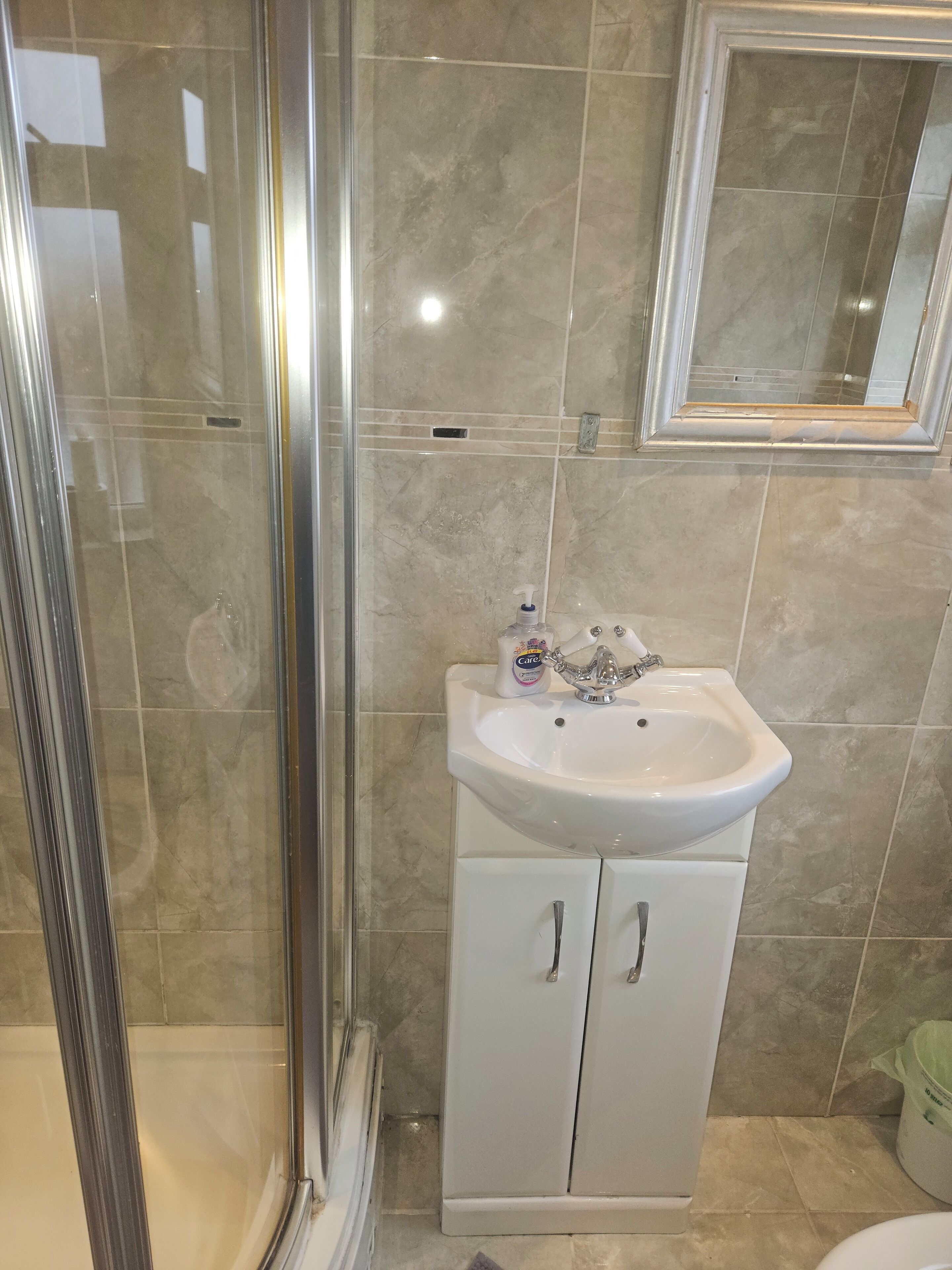 Shower, towels, soap, toilet paper