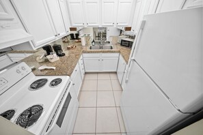 Superior 1-Bedroom King  w/ Kitchen & Sofa Bed | Private kitchen | Full-sized fridge, microwave, oven, coffee/tea maker - Coco Palms Apartments By Lowkl  (Pompano Beach)