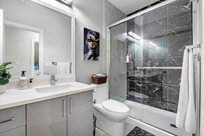 Shower, hair dryer, towels, soap