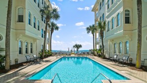 A rectangular swimming pool with a clear blue water, surrounded by a paved walkway. - SPECTACULAR CONDO, GULF-FRONT, VIEWS, POOL, GRILL, LG. PATIO, PRIVATE BEACH (Santa Rosa Beach)