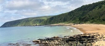 Private location overlooking lush glen. Short walk to beautiful secluded beach.