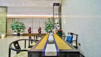 A conference room with a long table, chairs, and decorative elements.