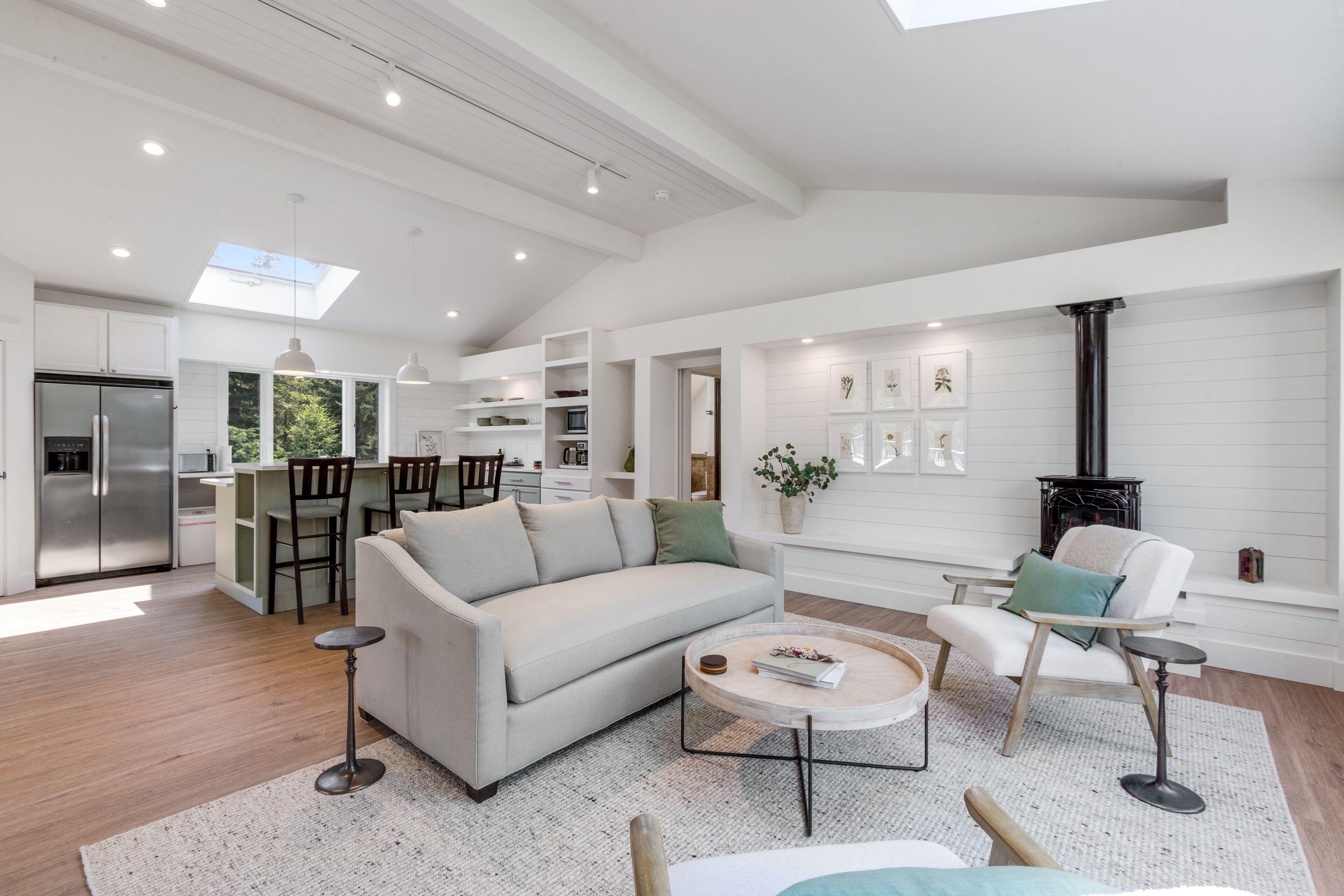 New construction - upper-level home with expansive deck & orchard views