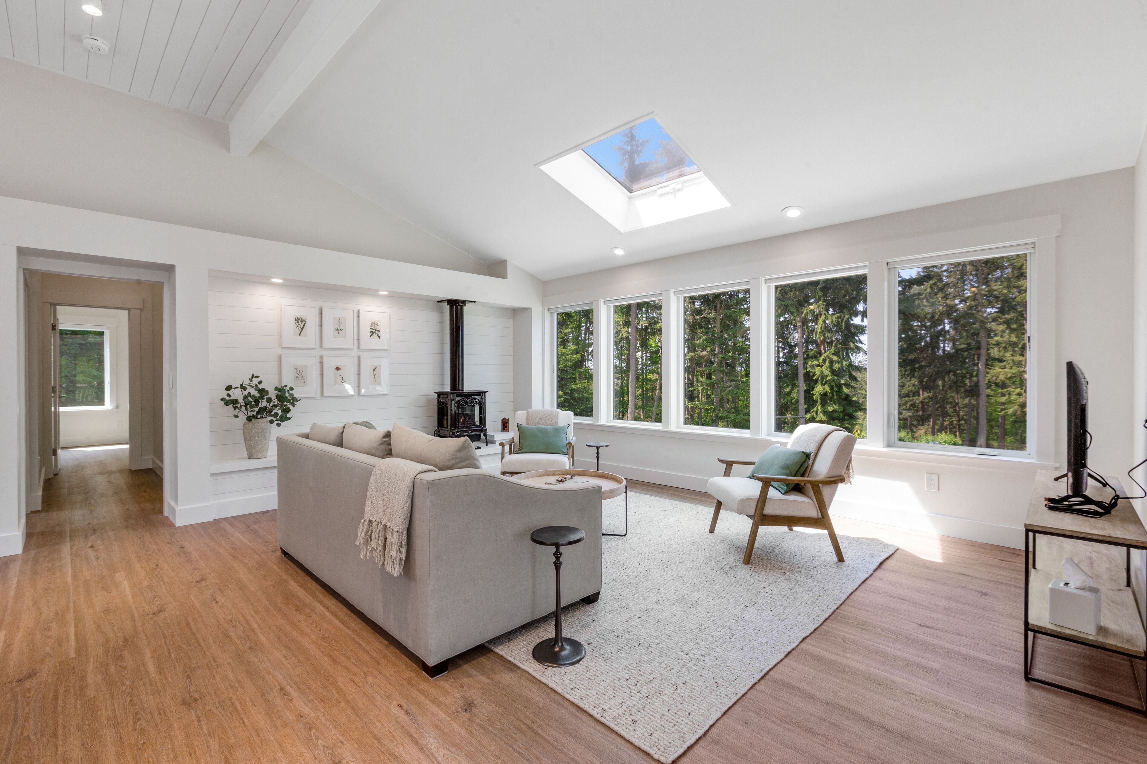 New construction - upper-level home with expansive deck & orchard views