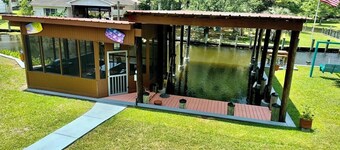 BEAUTIFUL WATERFRONT .  GNAT SCREENED BOATHOUSE AND AJOINING COVERED BOAT SLIPS
