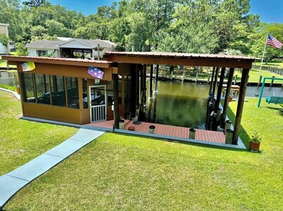 BEAUTIFUL WATERFRONT . GNAT SCREENED BOATHOUSE AND AJOINING COVERED BOAT SLIPS