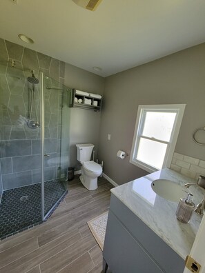 Shower, hair dryer, towels, soap